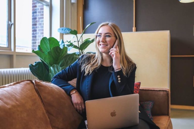 Business owner on a call at a laptop